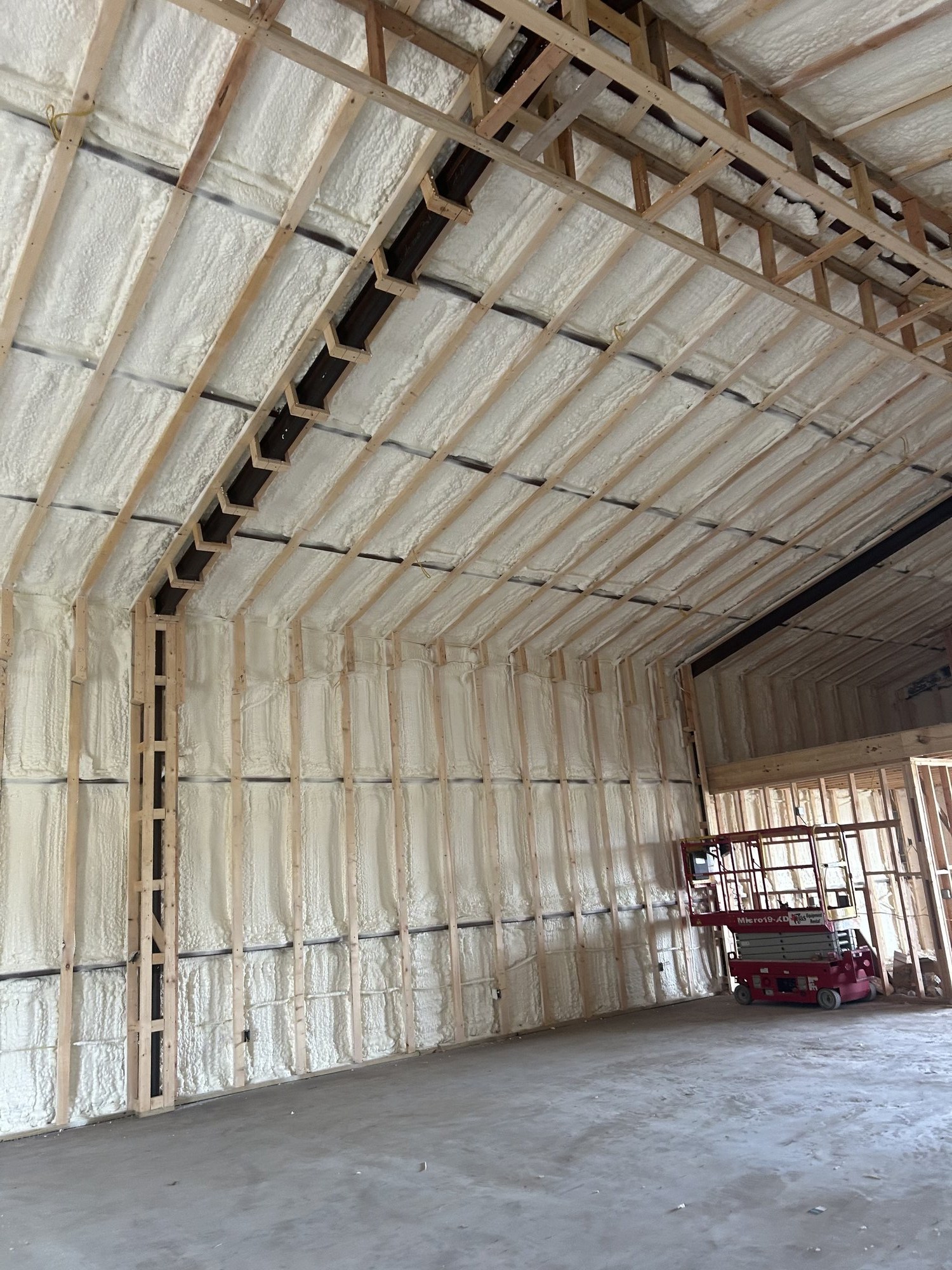 Premium Spray Foam roof deck insulation with exposed framing in Weslaco, TX