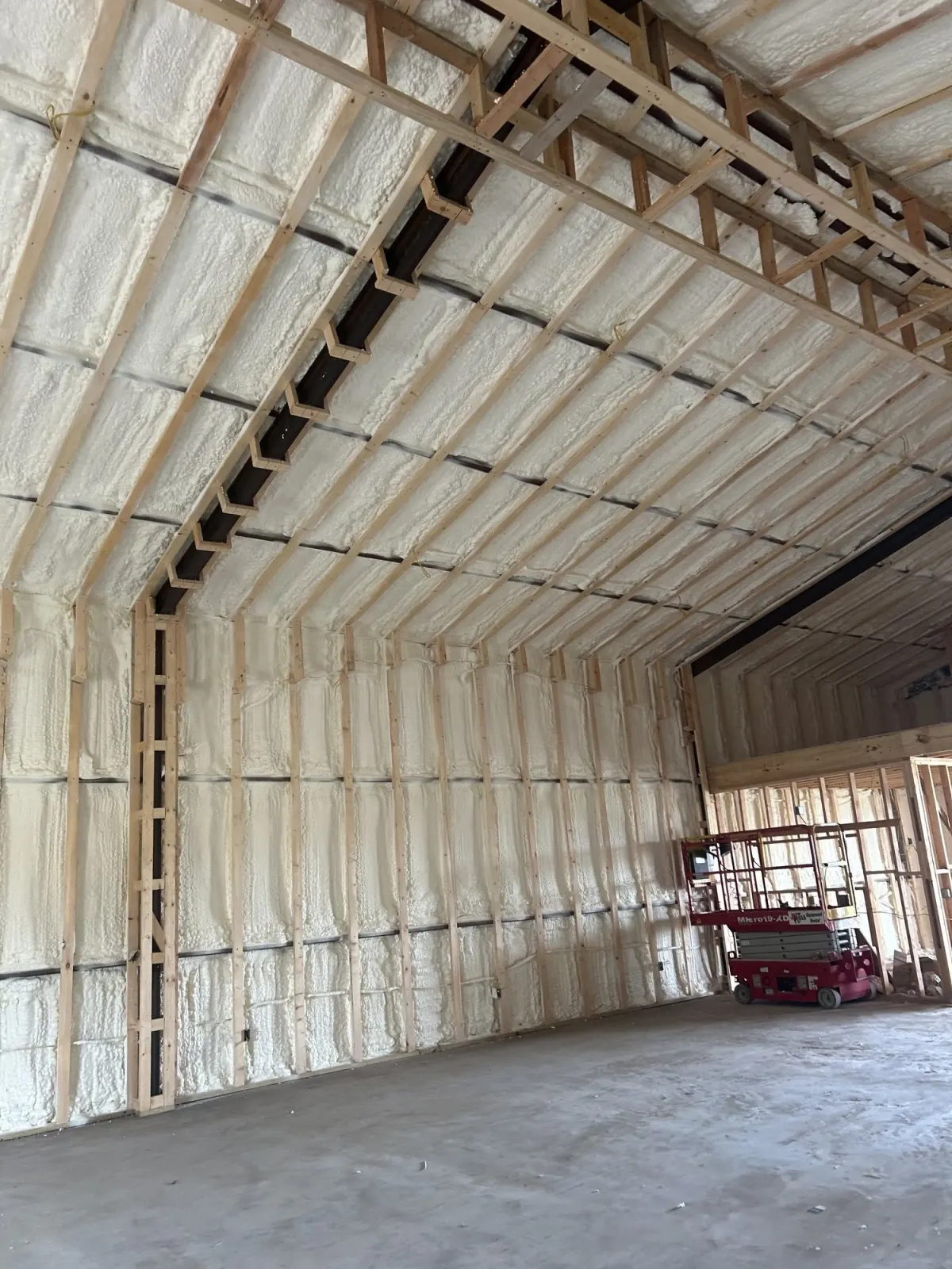 Premium Spray Foam roof deck insulation with exposed framing in Weslaco, TX